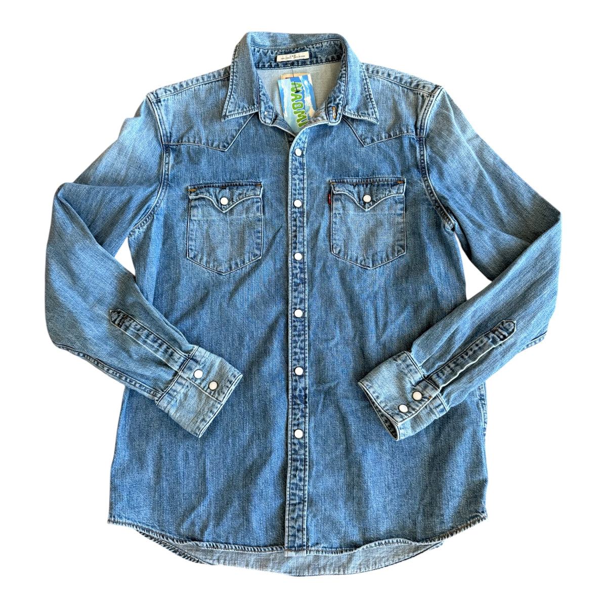 A light blue denim western-style shirt jacket with long sleeves, button-down front, and two chest pockets, laid flat on a white background.
