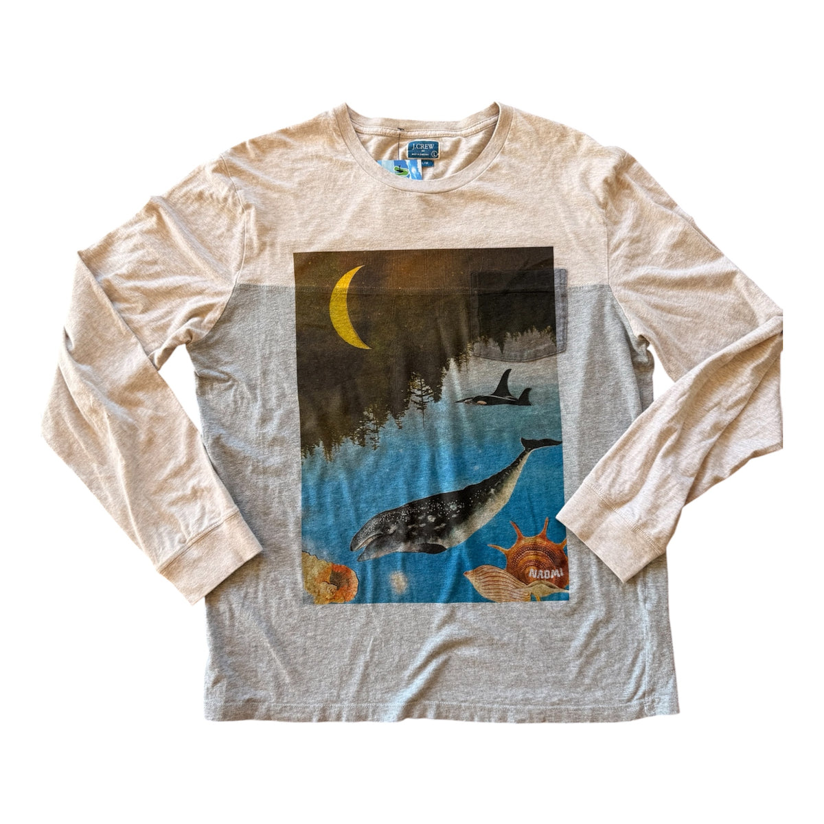 A long-sleeve t-shirt in a heathered light beige and gray colorway, featuring a large graphic print on the front of a whale, a narwhal, a crescent moon, and sea creatures in a dark, moody scene.