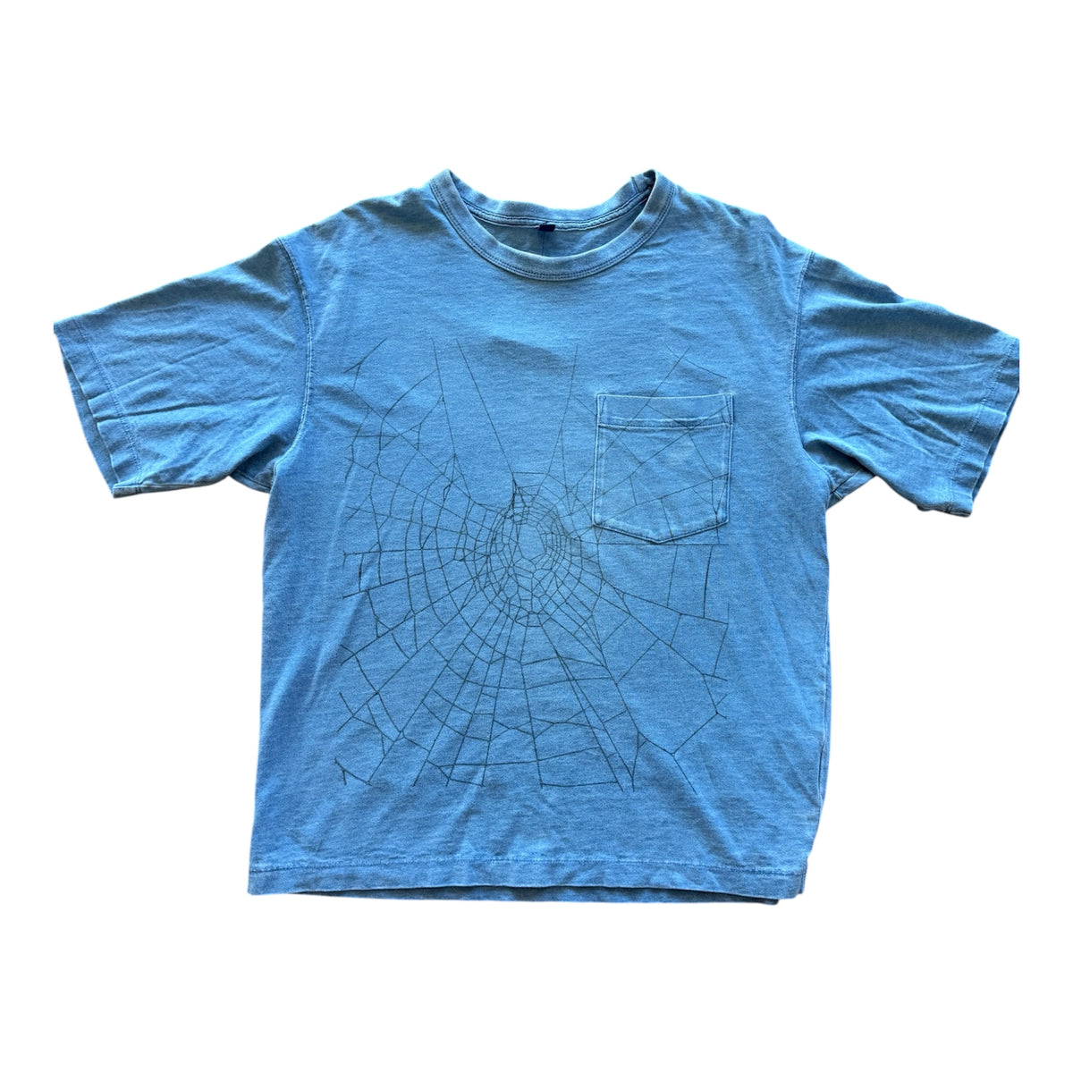 A light blue short-sleeve t-shirt with a chest pocket, featuring a black spiderweb line-art graphic printed on the front.