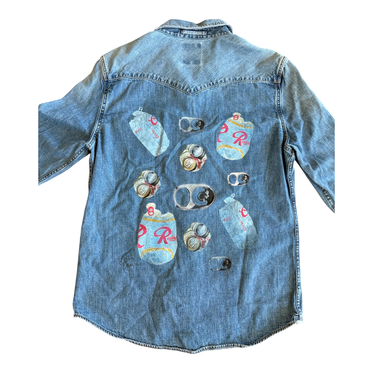 A light blue denim shirt shown from the back, featuring a graphic print of multiple vintage-style beer cans with the iconic red 'R' logo.