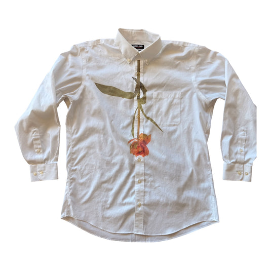 An off-white long-sleeve button-down shirt featuring a large watercolor-style floral print of a red flower and green leaves on the front, laid flat against a white background.