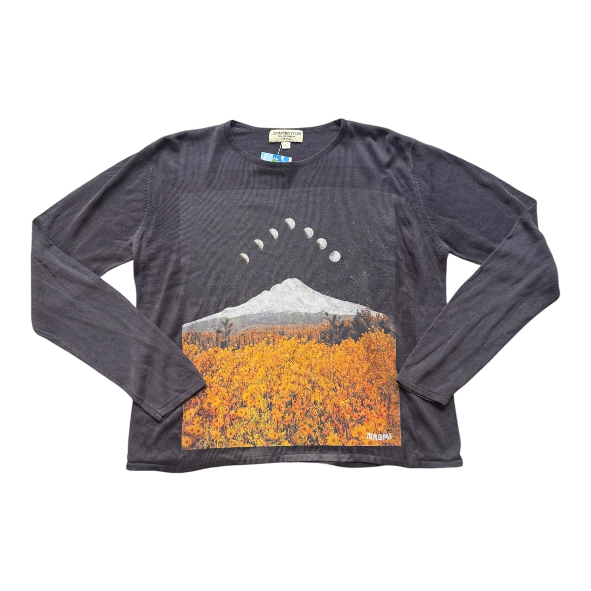 A dark dark navy long-sleeve t-shirt with a large graphic print on the front showing a mountain, an autumn field, and a moon phase sequence.