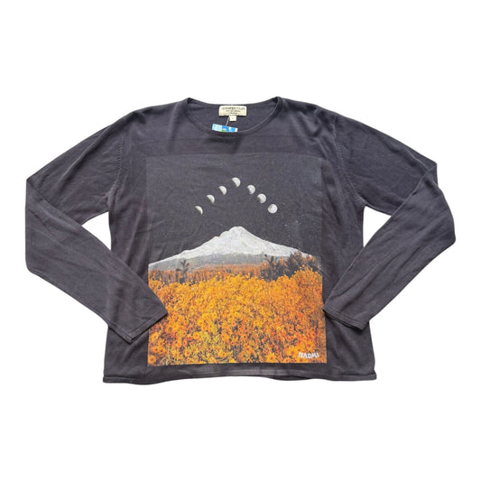A dark dark navy long-sleeve t-shirt with a large graphic print on the front showing a mountain, an autumn field, and a moon phase sequence.