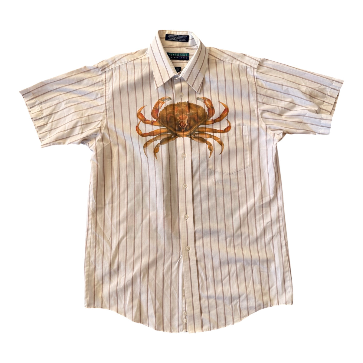 A short-sleeve button-up shirt in cream and beige vertical stripes, featuring a large brown crab graphic printed on the left chest, displayed flat against a white background.