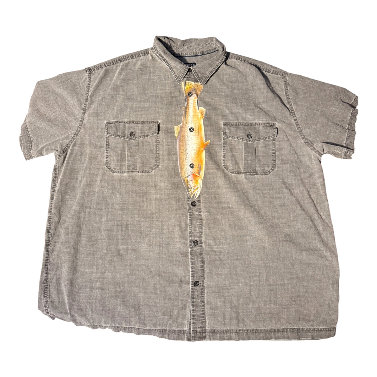 Grey short sleeve button down shirt with a fish printed down the center front to look like a tie. Laid flat against a white background 