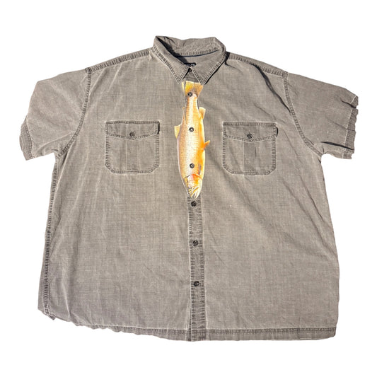 Grey short sleeve button down shirt with a fish printed down the center front to look like a tie. Laid flat against a white background 