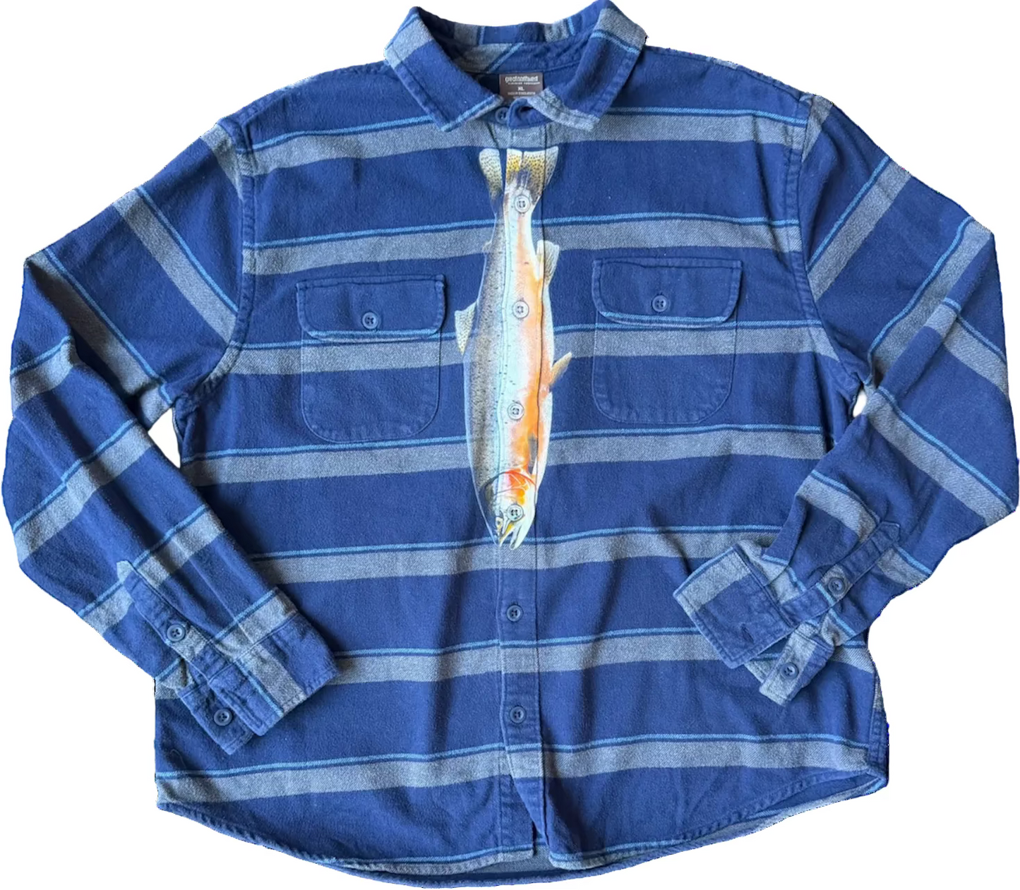 A blue and gray striped long-sleeve button-up shirt with a printed fish graphic on the front, laid flat against a white background.