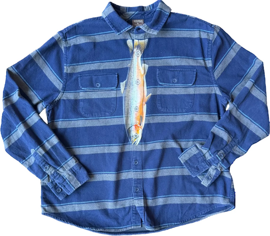 A blue and gray striped long-sleeve button-up shirt with a printed fish graphic on the front, laid flat against a white background.